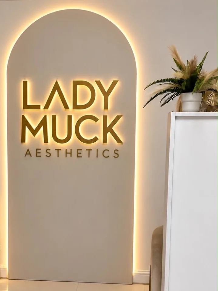 The Lady Muck Aesthetics clinic, with the gold illuminated sign