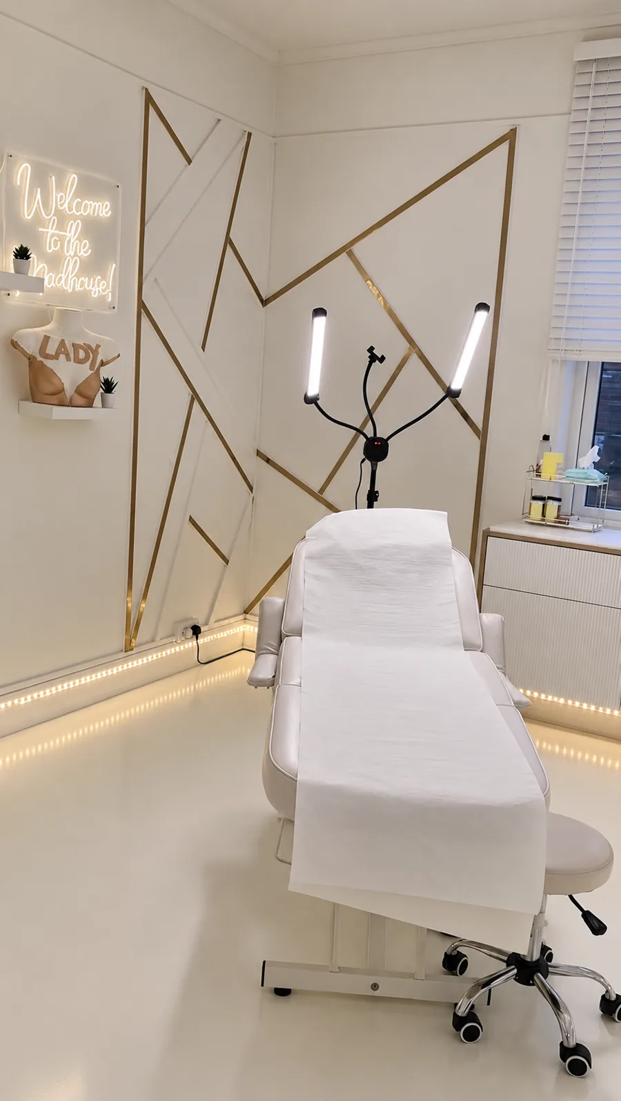 Treatment chair in front of the gold feature wall